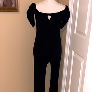 Guess off the shoulders, keyhole, draped sleeves.